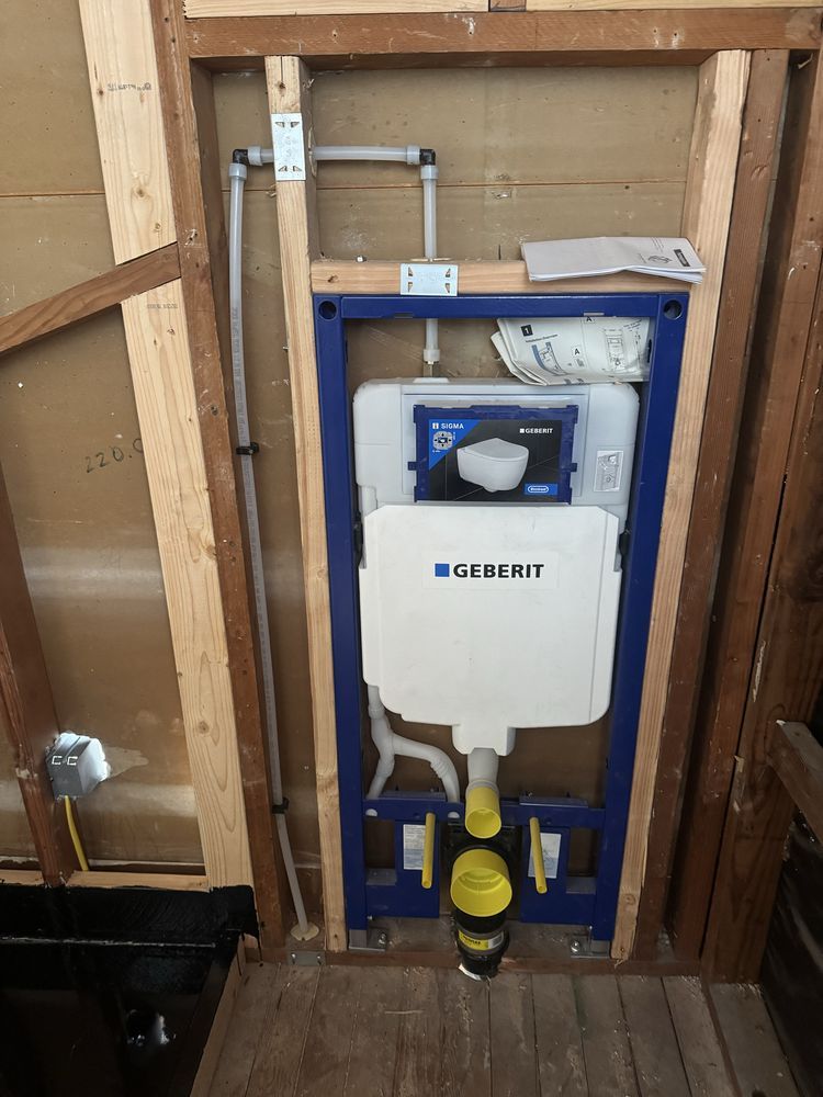 Geberit in-wall carrier & tank system rough-in for a modern condo bathroom